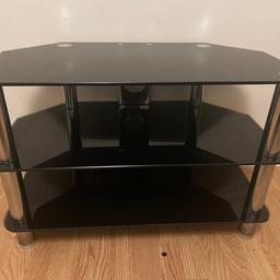 Black glass tv table can collect or deliver. (Within 3 miles).