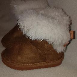 Toddlers size 5 faux fur lined ugg style Snow Boots in very good condition. See photos for condition and size. I can offer try before you buy option but if viewing on an auction site viewing STRICTLY prior to end of auction.  If you bid and win it's yours. Cash on collection or post at extra cost which is £4.55 Royal Mail 2nd class signed for. I can offer free local delivery within five miles of my postcode which is LS104NF. Listed on five other sites so it may end abruptly. Don't be disappointed. Any questions please ask and I will answer asap.