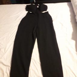 womens black trouser/playsuit with open back ..
bralet is attached to trousers all in one ..
Tags still on 
size 14