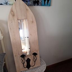 Beautiful church style, wall hanging,unusual mirror. Quite heavy,solid wood. Antique effect finish to the wood,with duo black metal candle sconces,change in decor forces sale. Beautiful statement piece to decorate any room. I had it in my bathroom. Sell for £30.00 OVNO. Very unusual piece.