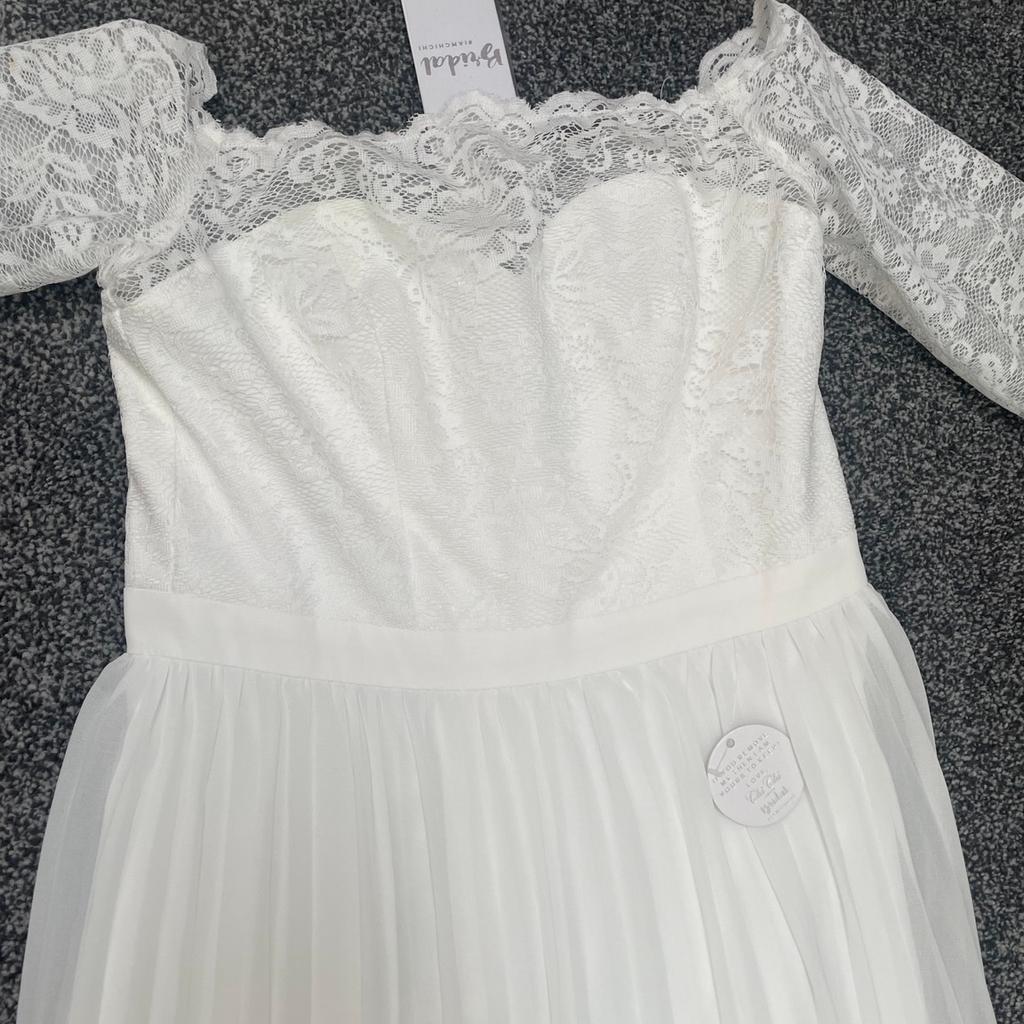 Brand new. White. Wedding dress size 12