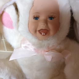 Unusual doll in Rabbit costume. Lovely face, for child over 3yrs. 
 Has got eyelashes, and flowers on top of ears.