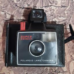 vintage polaroid super swinger land camera
in great condition very decorative on display.