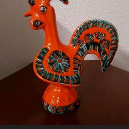 Seltene Aldo Londi Bitossi Keramik-Figur Hahn, 60er/70er Jahre, aus Haushaltsauflösung. Orange/Grün. Maße ca. 23 cm hoch x 11 cm breit x 16 cm tief. Sehr guter Zustand. Versand bei Übernahme der Versandkosten möglich.