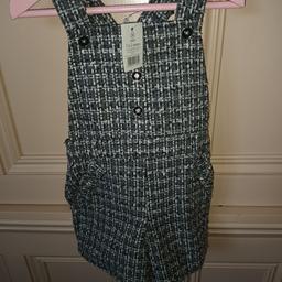 LOVELY BIB AND BRACES SHORTS. £5 GREAT WITH TIGHTS. HAS TAGS
 SOFT FINE CORD SKIRT WITH NET AND SEQUINS.£3:90
CAN POST.