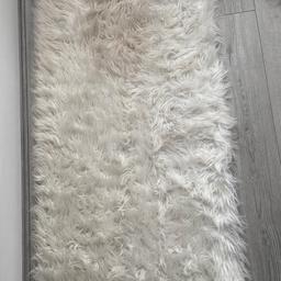 White fluffy rug

Please note there is a little makeup stain on rug which can be removed if scrubbed but not noticeable 
