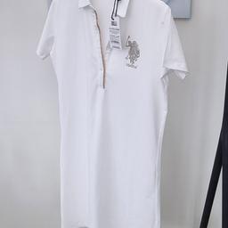WHITE T.SHIRT DRESS. THIS IS A BRAND NEW SIZE 12 DRESS WITH LABEL STILL ATTACHED.
AS YOU CAN SEE THERE ARE CLEAR COLOURED CRYSTALS AROUND TOP OF DRESS AND THE CRYSTAL ENCRUSTED HORSE AND JOCKEY LOGO TO SET OFF YOUR BEAUTIFUL OUTFIT. PERHAPS WEAR WITH SUMMER CROPPED JEANS OR A PAIR OF MARINE BLUE LEGGINGS WOULD SET THIS DRESS OFF BEAUTIFULLY.

COST NEW £40.00

Cash on Collection preferred. However shipping can be arrange at buyers own cost. Thank you
Thank you for looking.