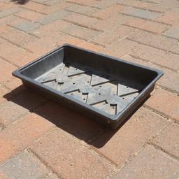 Over 100 available @ £2 each :- Re- usable solid plastic Seed trays with drainage holes approx. 14ins x 9ins with a capacity for Fifteen 3ins pots.