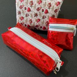 This set comes with a charm boxy bag, a purse bag and a small coin bag. Ideal for storing make up, jewellery, pens and pencils the list is endless!

All handmade items.
