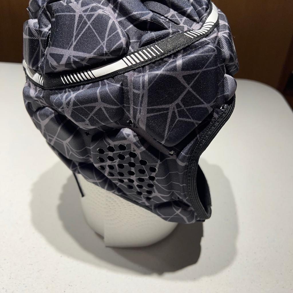 Rugby head protection. Brought for my son to use in rugby practice but was never used. Excellent quality Looks brand new. Size is listed in last photo. Comes from a smoke and pet free home.