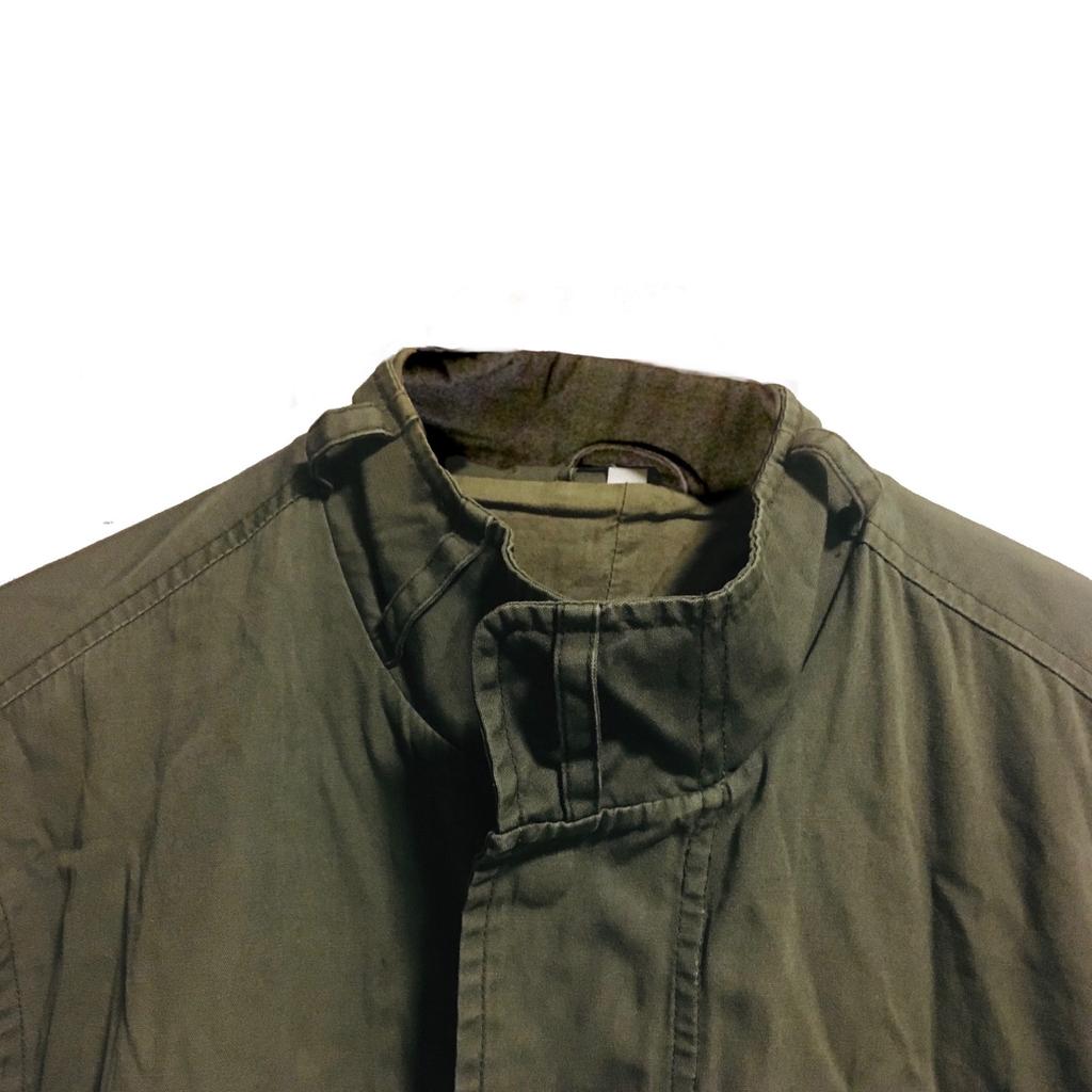 RARE Vintage Army Field Jacket
Excellent condition
Size M
There’s something about military apparel that’s just incredibly appealing.
Authentic design - this classic military field coat has been inspired by the iconic M-65 style. Designed to be oversized in the body and sleeves. This field jacket is constructed using a sturdy pre-washed 100% cotton fabric with the lining made of cotton too and it has been garment-dyed for a vintage look and feel. It features two large exterior flap pockets at the waist, two large exterior utility chest pockets, the four with snap fastener closures; one interior welt pocket to help carry your essentials, storm cuffs which fold up when not required, Velcro cuff adjustment, a button tap protecting the zipper and a signature wire field zipper on the front with snap fasteners. An original and unique design as the high collar comes with belt loops throughout.
Relaxed fit, keeps you warm and protected against the elements. Machine washable.
Imported