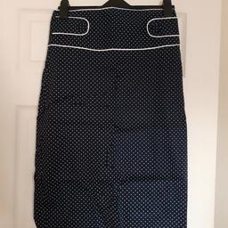 Pencil skirt
Navy blue with white spots
Size 12 but would suit size 10
Button details on the waist band
Zip and button fastening at the back
Never worn