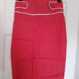 Pencil skirt
Red with white spots
Size 12 but would suit a size 10 too.
Button details on the waist band
Zip and button fastening at the back
Never worn