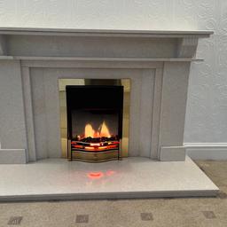 Marble fire surround with electric fire
Fire does provide heat
Measurements of surround 
Overall height - 1100mm
Top section - 1510mm L x 240mm D
Middle section - 940mm L
Plinth - 1520mm L x 530mm D