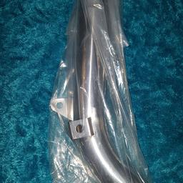 A brand new unused mid-link pipe for the Honda Varadero 125