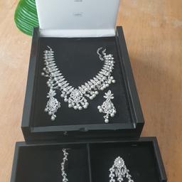Beautiful statement jewellery set, unworn gift. Made using Austrian Crystals & Nickel Free for sensitive skin. White stones & pearls set on rhodium plated silver jewellery. High quality jewellery box included. Original price was £1000.
Can be collected from Romford if it’s more convenient than Upton Park.