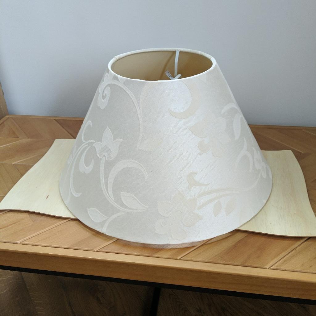 lovely cream coloured Lamp shade. size of the bottom of the shade measures 18inches ,it has a lovely pattern on it