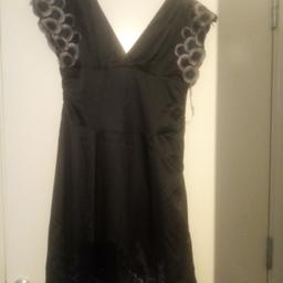 Black pure silk Karen millen dress. Peacock effect on the sleeves and bottom of dress.
Knee Length.
As new. Never worn
Happy to post for additional postage fee.
