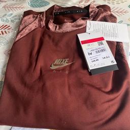 Brand new Nike top (bronze /silver tick ) got this for my wife but too small this is a large size 14