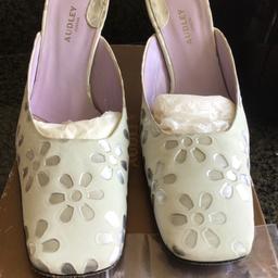 Beautiful pair of White and Silver shoes
Size 5.
Ex. Condition