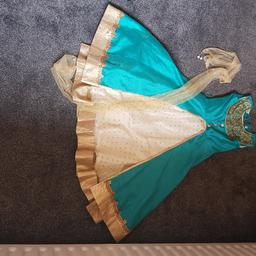 indian dress has 2 layers a lovely shade or turquoise with some gold like new