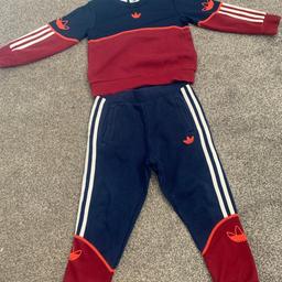 Navy and red boys tracksuit.