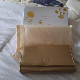  Brand new in box with dust bag genuine Pandora limited edition gold shine clutch bag with inner pocket
measures 9.5 inches w x 5.5 inches