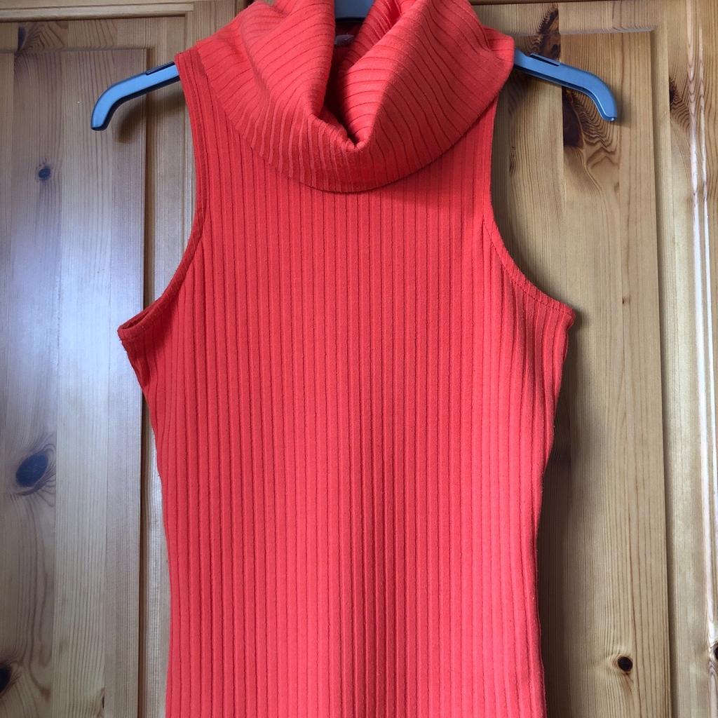 Bright orange, sleeveless rib top with cowl neck, by River Island, size 6.
Hardly worn so still in good condition.