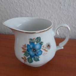 Pretty Vintage Jug Perfect Undamaged Condition. Never used, stored away in mam's cupboard all its life. Can't read maker's mark/stamp. White with gold trim, blue floral design. Size 4.5 in high, 6 in wide including handle. Dates back to 70s era. From smoke and pet free home, check out my other items. Happy to combine postage for multiple purchases or collection from DL5. Thanks for looking.