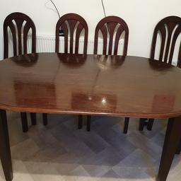 dark brown wooden Table and 6 chairs set however 1 chair will need fixing, very sturdy with minor wear and tear.