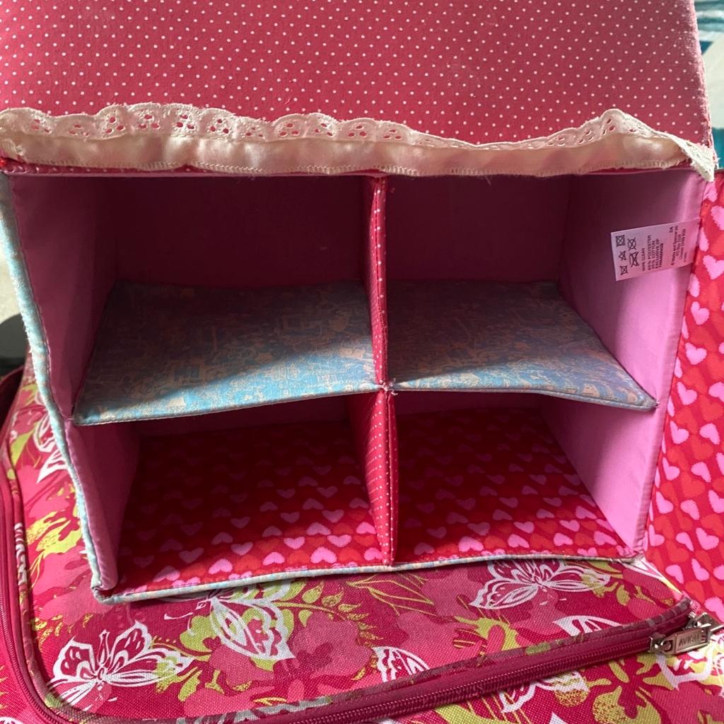 Cute little fabric dolls house with a handle and a large opening door, hardly been used in from a clean and smoke free home.
