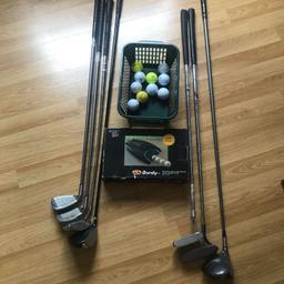 golf items auto putting machine,10 balls,7 and 9 iron,2 drivers,2 putters and sand driver