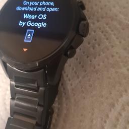 armani exchange mens smart watch . never worn..unwanted present .with spare links.and charger cable.uses a USB.has heart rate monitor.fit. etc

sorry no offers. 
