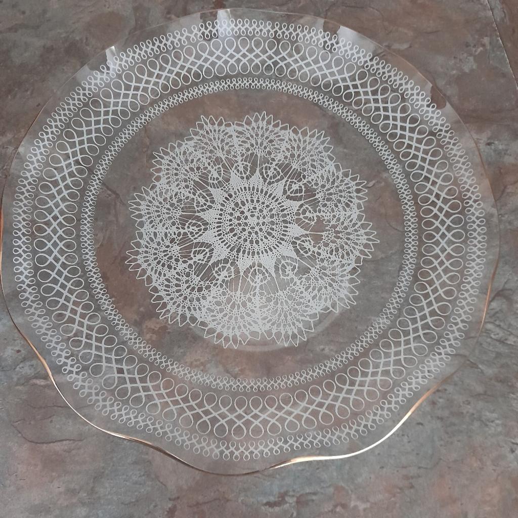 Gorgeous and real quality Vintage Round Glass Serving Platter. Immaculate Undamaged Condition, hardly used considering age from early 60s era. Most of its life on display in a glass cabinet. Fluted edge with gold trim, white delicate doyley like design in glass. Diameter 9.5 inches. Looks stunning at an afternoon tea table or a party with cakes/sandwiches or other party food. From smoke and pet free home. Check out my other items. Happy to combine postage for multiple purchases or collection from DL5 Thanks for looking.
