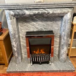 This fireplace is in very good condition modern colour grey solid marble so very heavy but comes apart in sections so easily move will be dismantled to go it comes with the electric fire size of the fireplace is 177 cm high shelf is 123 Lx23cmW the bace L123x115 buyer must collect No time wasters thanks