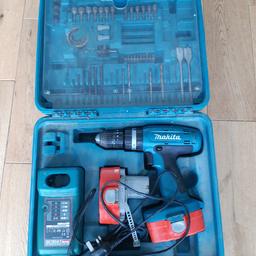 Makita power drill with charger,  2 batteries and some accessories in a carry case ( clip is broken) .
Batteries do charge, but do not hold charge overnight. 

CASH AND BUYER COLLECTS ONLY 

NO POSTING