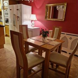 lovely solid oak table and two solid oak real leather chairs
