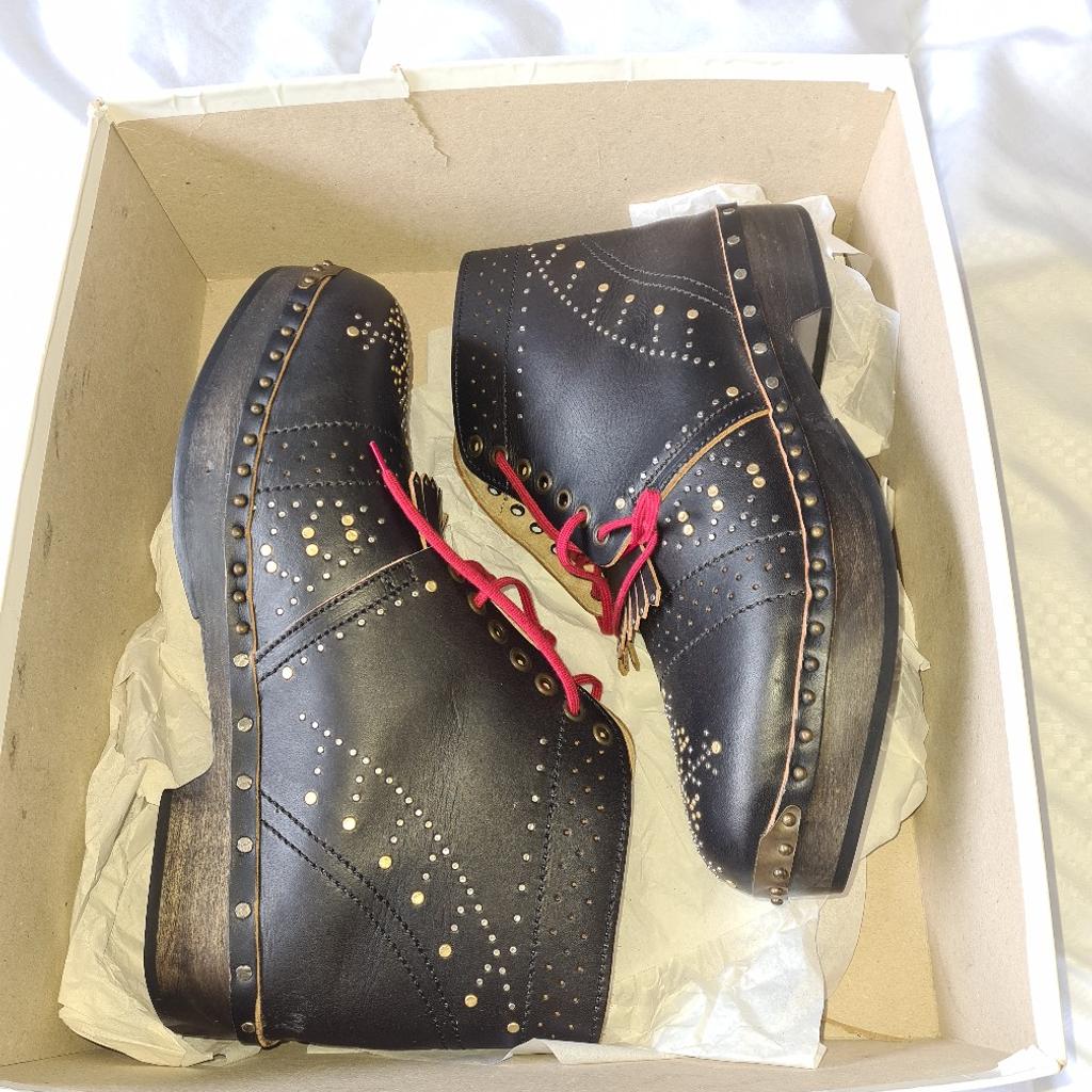 Burberry Black Studded Leather Antrim Fringe Detail Clog Boots bundle. New With box 2 old unused blank Burberry diaries and Burberry paper bag. Please be aware the box is in poor condition but the boots are immaculate.
See photos for condition and size. I can offer try before you buy option but if viewing on an auction site viewing STRICTLY prior to end of auction.  If you bid and win it's yours. Cash on collection or post at extra cost which is £15 Royal Mail special fully insured next dat delivery. I can offer free local delivery within 30 miles of my postcode which is LS104NF. Listed on five other sites so it may end abruptly. Don't be disappointed. Any questions please ask and I will answer asap.