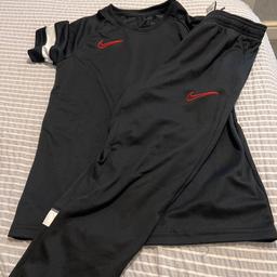 Boys Nike T-shirt and tracksuit bottoms 
Both large boys 
Worn once
