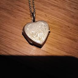 Silver Heart shaped locket with chain in good condition. 

Collection from Warboys or postage and local delivery available