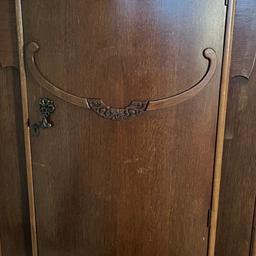 A unique vintage wardrobe with beautiful detailing. Inside is a storage shelf, main hanging rail and door rail.

 Dimensions:
H: 145cm, W:80cm and D:50cm