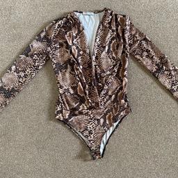 Zara snake print bodysuit.
Size S, UK 6 or smaller 8.
Wrap detail top part with deep V neck.
In a very good condition.