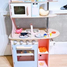 Kids wooden play kitchen with the matching toys
Play food.
Wooden coffee maker and blender.

Has got sink tap one side has oven
Other aide has dishwasher and fridge.
On wheels so.easy to maneuvers.


Have a look at my other toy listings for bundle price discount purchase