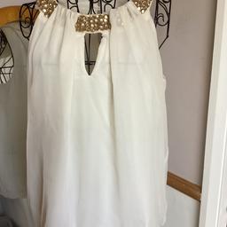 Dorothy Perkins 
Sleeveless top
Beaded detail on front
Elasticated bubble hem
Lined
Front key hole neck
 Back keyhole with 2 bottom fasten 
Collection or postage available