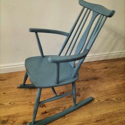 A lovely small rocking chair. I had this in my son's nursery next to his bookcase when he was a baby.
Its an antique chair painted blue with a vintage look. it does have a damaged arm but can be glued /fixed (see photos) . This could make a lovely addition to a baby's nursery or simply used for decoration
