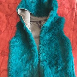 Lovely faux fur teal coloured girls age 11 gilet.
Only worn a few times