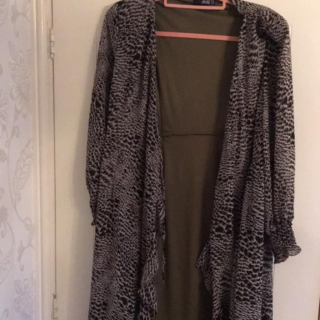 Stunning grey, taupe & black long sleeve outer wear piece. Can be worn open as a cover up or for a wedding over an outfit. Wow factor . Long sleeves. By Quiz size 14. Smoke & pet free home