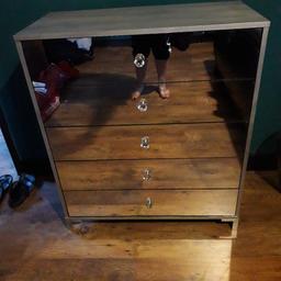 CHEST OF DRAWERS WITH MIRROR FRONT.
EDGING IS SILVER .
THE TOP DRAW AS GLUE OR SOMETHING...BUT DOES NOT EFFECT OF USE AS ITS DRY.
TBH I JUST PUT LINING INSIDE .
SELLING DUE TO CHANGE OF DECOR .
COLLECTION ONLY ..
NO OFFERS .
