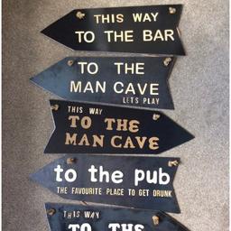 These have been made using reclaimed steel. They either point to the left or right. On the front they have wooden lettering. 4 designs available. Quirky, unique and complete one offs. They have an industrial raw steel look. Each sign hangs by rope. They are approx 50cm W x 20cm W (not including the rope). These signs within time will naturally dis-colour and will have a rust patina appearance.
I am able to give a coat of lacquer which will prevent rust to a certain amount. Two of the signs have had lacquer which are...
“This Way To The Man Cave” And “This Way To The Bar”. You are able to see that with a coat of lacquer they have more of a polished shiny surface where as the others are a raw steel finish. If you require it having a coat of lacquer then please add a note when you purchase the item.
Great item for your own home decor or as a gift. Ideal man cave signs or for the garden “pub” shed.

Price includes free postal delivery (for one)