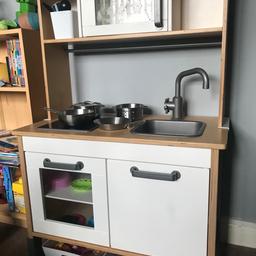 Lovely pretend play kitchen for kids
Comes with ikea saucepans and frying pans and a few extra bits like chopping boards, knives etc.
Lots of food included with some being able to be chopped in half and restuck back together. 
The lights on the cooker need new batteries. 
There are a few marks on the front from being loved and sticker marks but doesn’t affect use. 
Has a few ring marks on top also. Will put photo on.